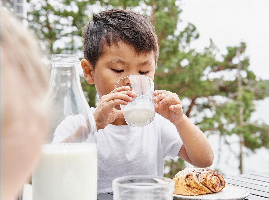 Boy drinking lactose free milk.